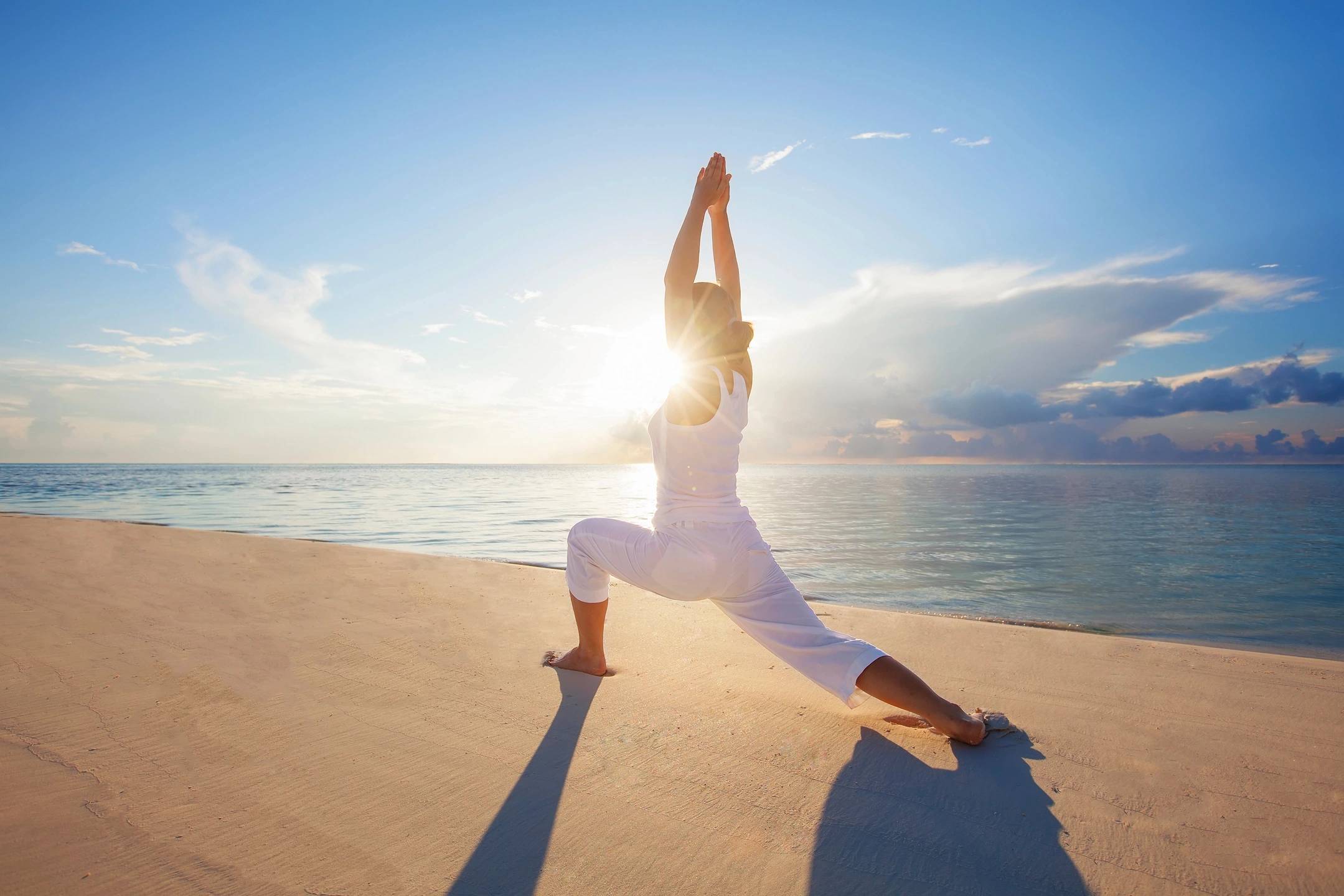 Smiling yoga practitioner in a yoga pose